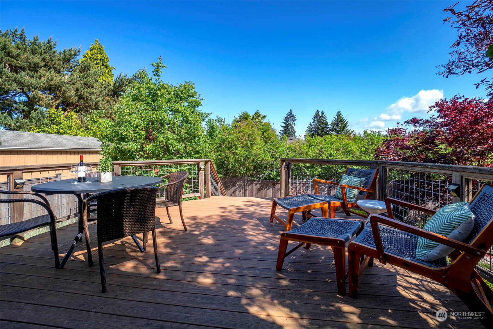 4100 Southwest Ida Street Seattle, WA 98136 - Photo 25 of 32 a view of a chairs and table on the deck with wooden floor