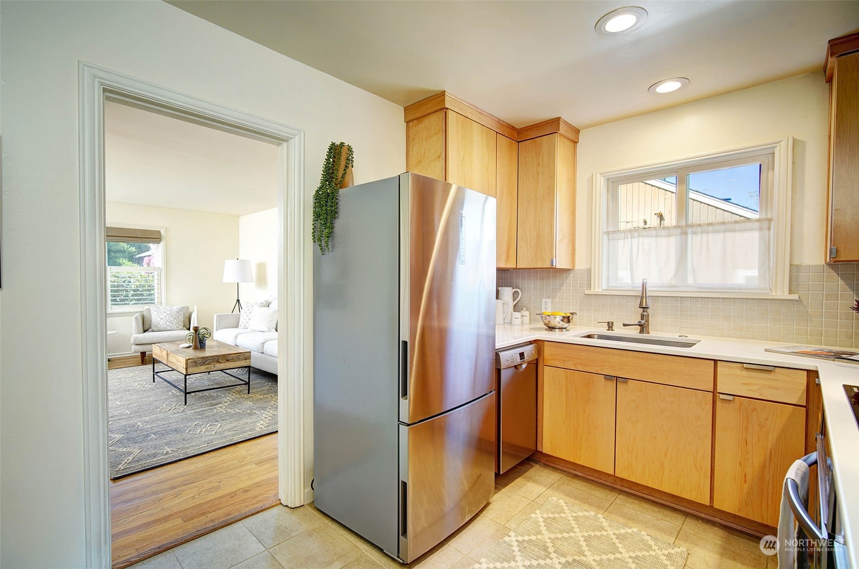 4100 Southwest Ida Street Seattle, WA 98136 - Photo 6 of 32 a kitchen with stainless steel appliances granite countertop a refrigerator and a sink
