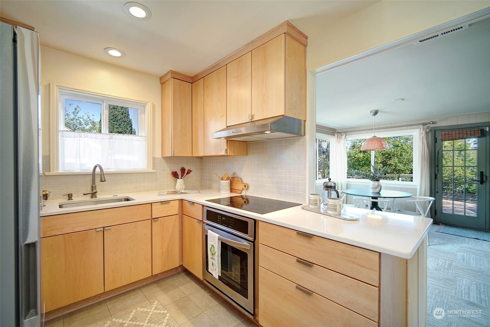 4100 Southwest Ida Street Seattle, WA 98136 - Photo 8 of 32 a kitchen with a sink stove and cabinets