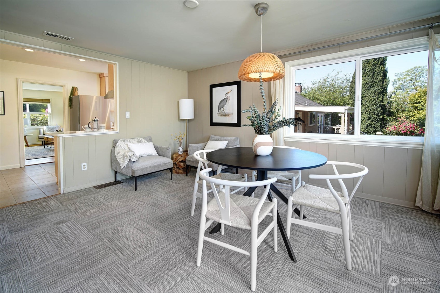 4100 Southwest Ida Street Seattle, WA 98136 - Photo 9 of 32 a dining room with furniture a chandelier and wooden floor