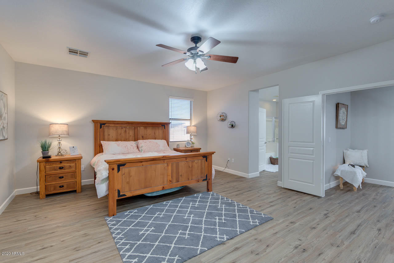 3315 East Los Altos Road Gilbert, AZ 85297 - Photo 33 of 66 a bedroom with a bed and wooden floor