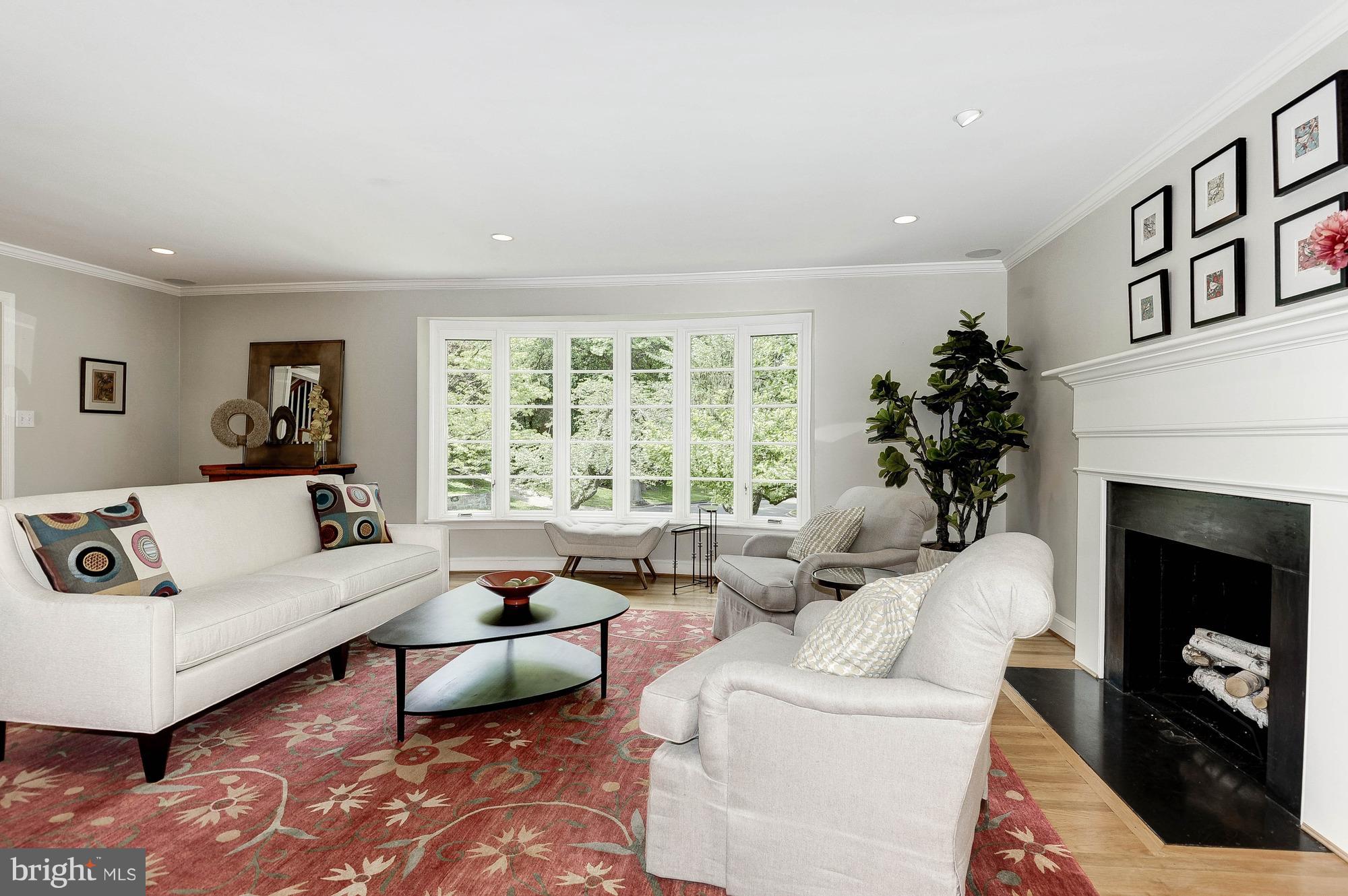 5120 Upton Street Northwest Washington, DC 20016 - Photo 2 of 22 a living room with furniture and a fireplace