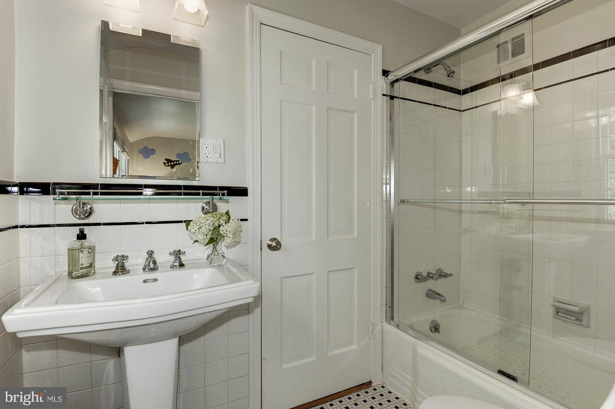 5120 Upton Street Northwest Washington, DC 20016 - Photo 11 of 22 a bathroom with a sink and a mirror