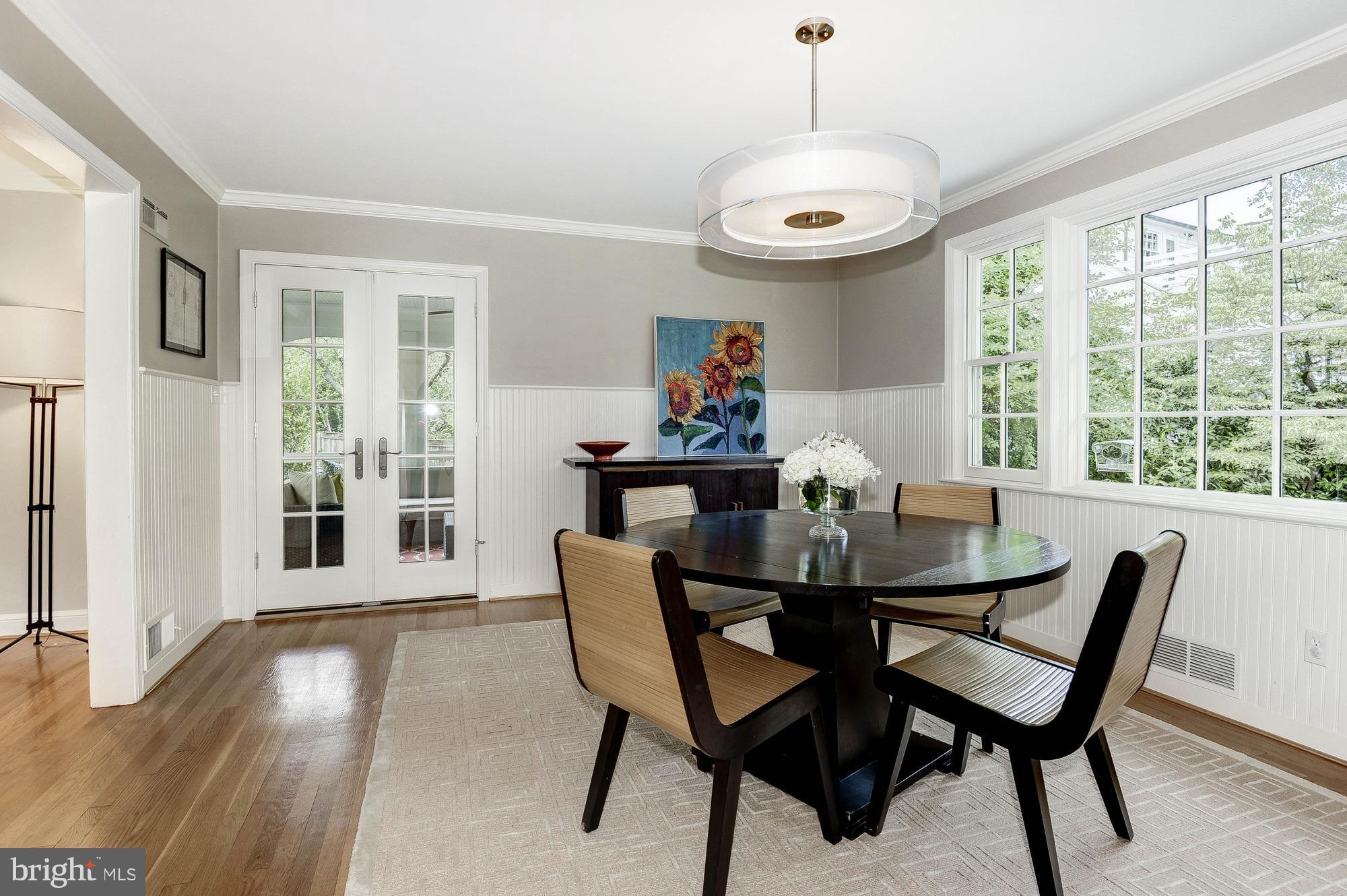 5120 Upton Street Northwest Washington, DC 20016 - Photo 3 of 22 a view of a dining room with furniture window and outside view