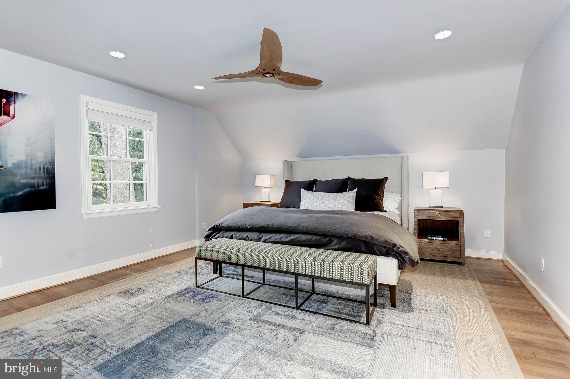 5120 Upton Street Northwest Washington, DC 20016 - Photo 10 of 22 a bedroom with a large bed and a window