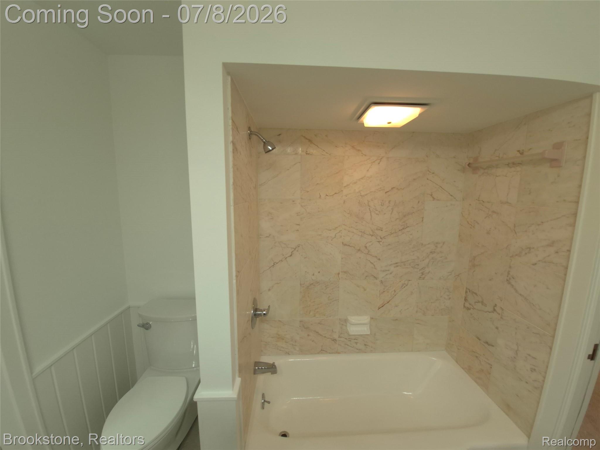 4140 South Henderson Road Davison, MI 48423 - Photo 69 of 98 Tub and shower combination featuring extensive tile surround