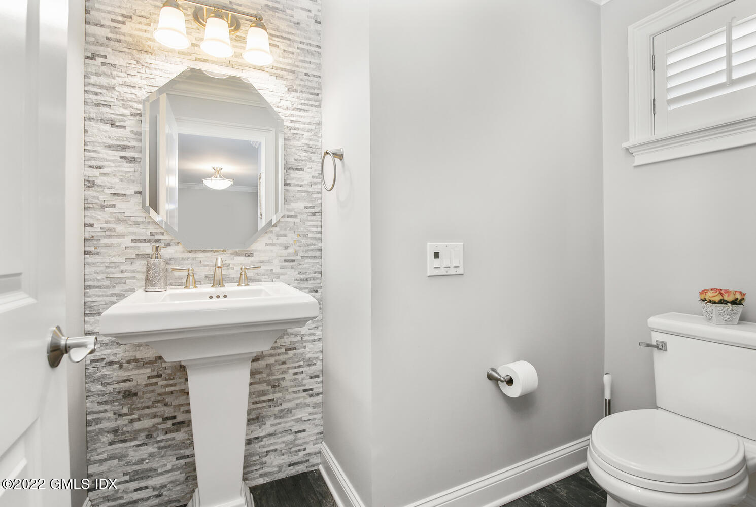 24 Harold Street, Unit C Cos Cob, CT 06807 - Photo 11 of 32 a bathroom with a sink toilet and mirror