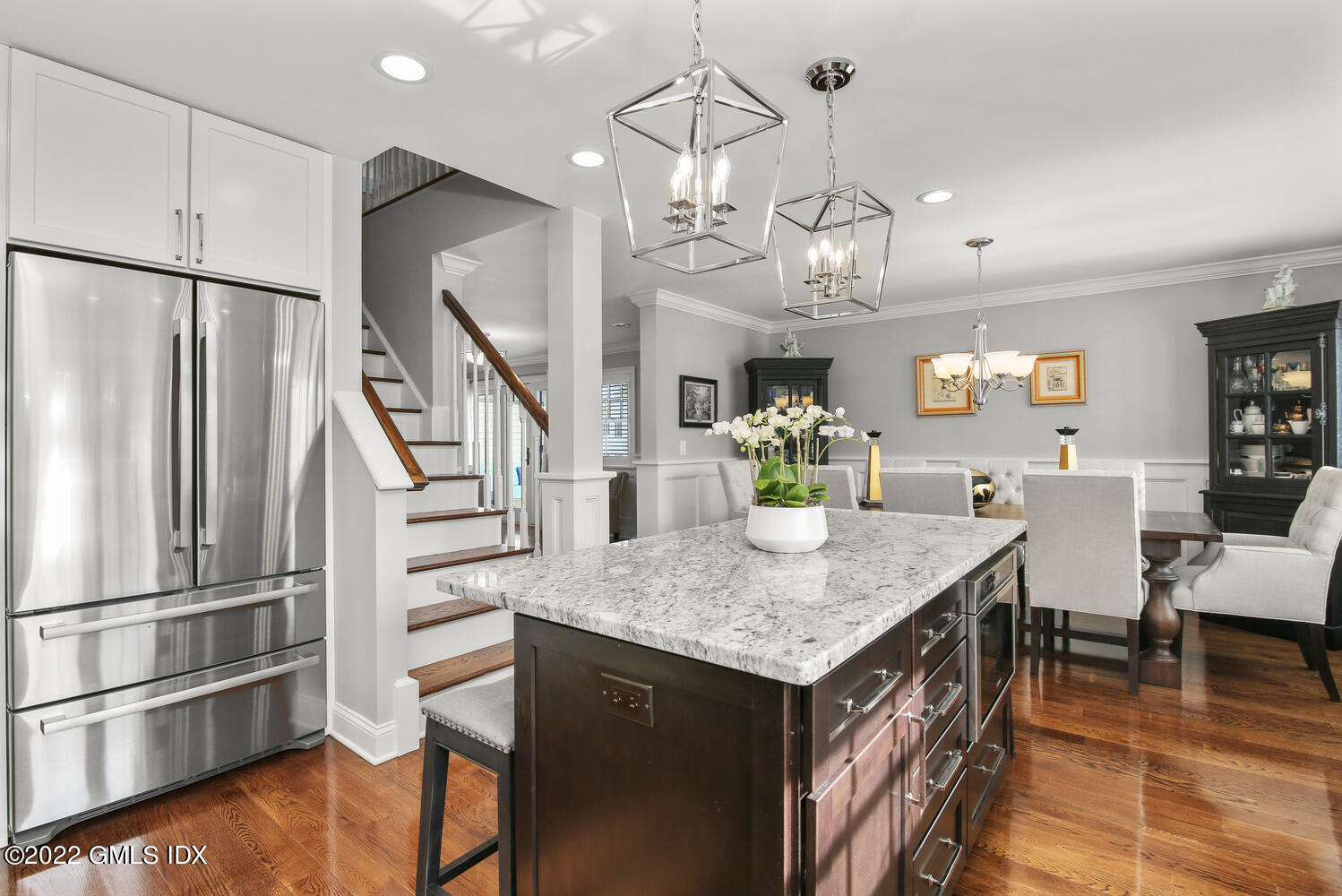 24 Harold Street, Unit C Cos Cob, CT 06807 - Photo 13 of 32 a view of kitchen island sink refrigerator dining table and chairs