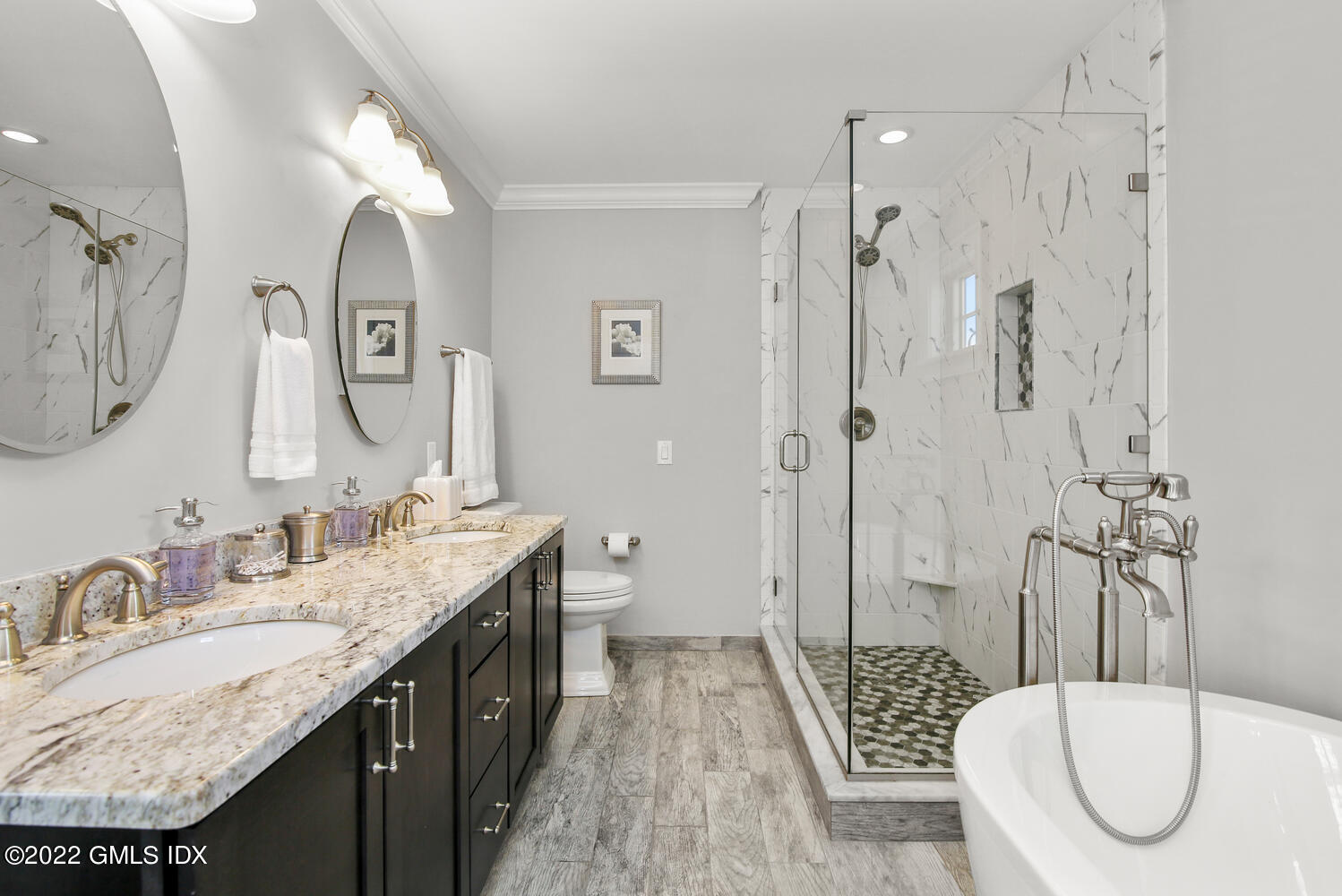 24 Harold Street, Unit C Cos Cob, CT 06807 - Photo 20 of 32 a spacious bathroom with a granite countertop sink mirror and a shower