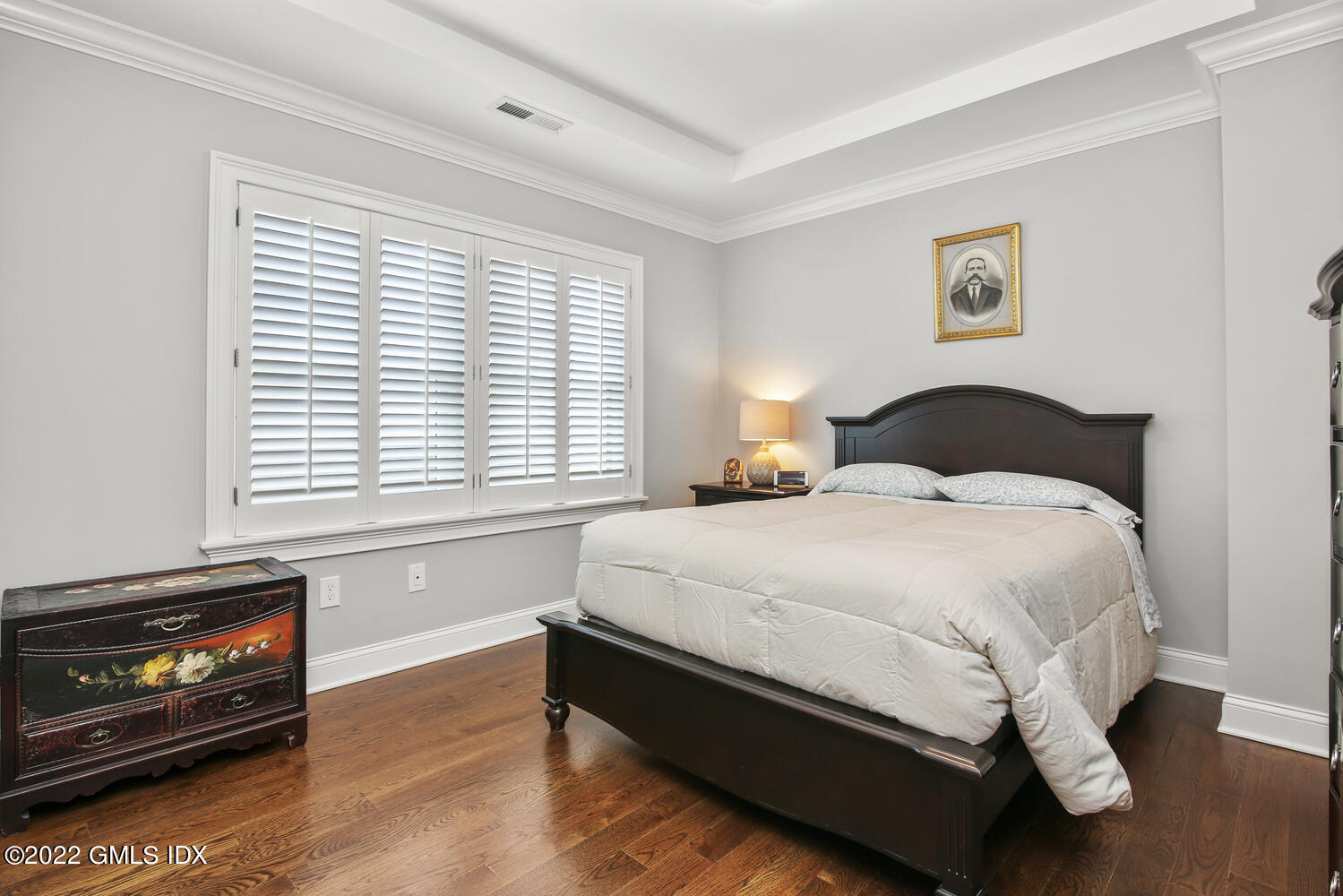 24 Harold Street, Unit C Cos Cob, CT 06807 - Photo 21 of 32 a large bed sitting in a bedroom next to a window