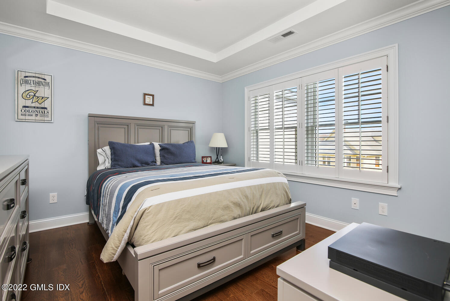 24 Harold Street, Unit C Cos Cob, CT 06807 - Photo 23 of 32 a bedroom with a bed and a night stand