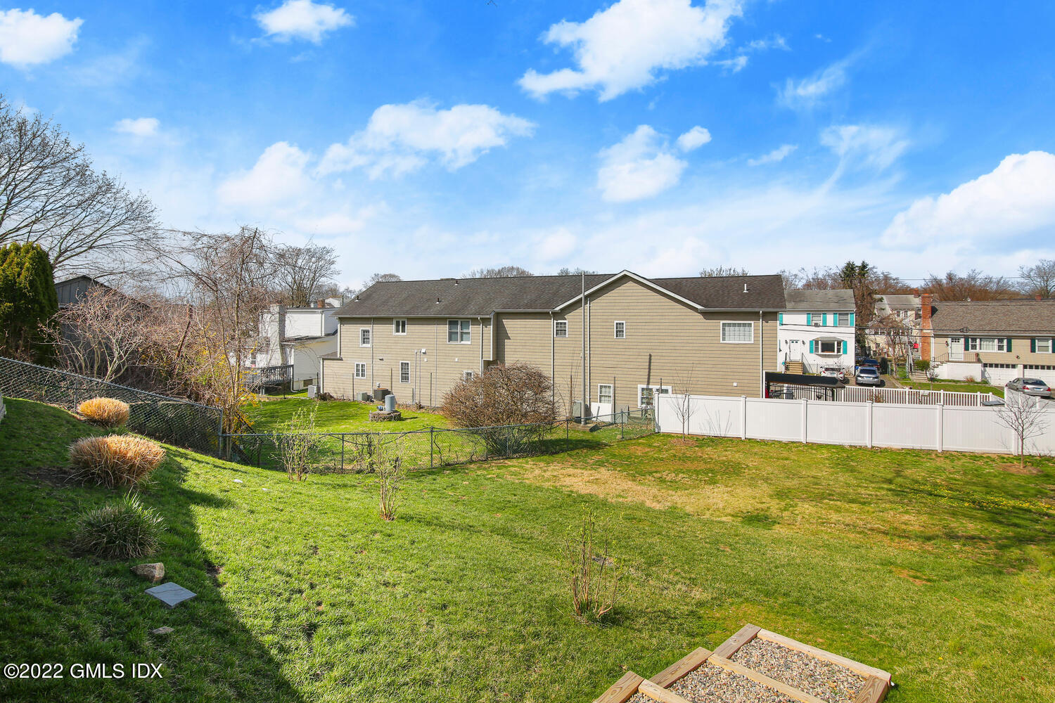 24 Harold Street, Unit C Cos Cob, CT 06807 - Photo 27 of 32 a view of a house with a yard