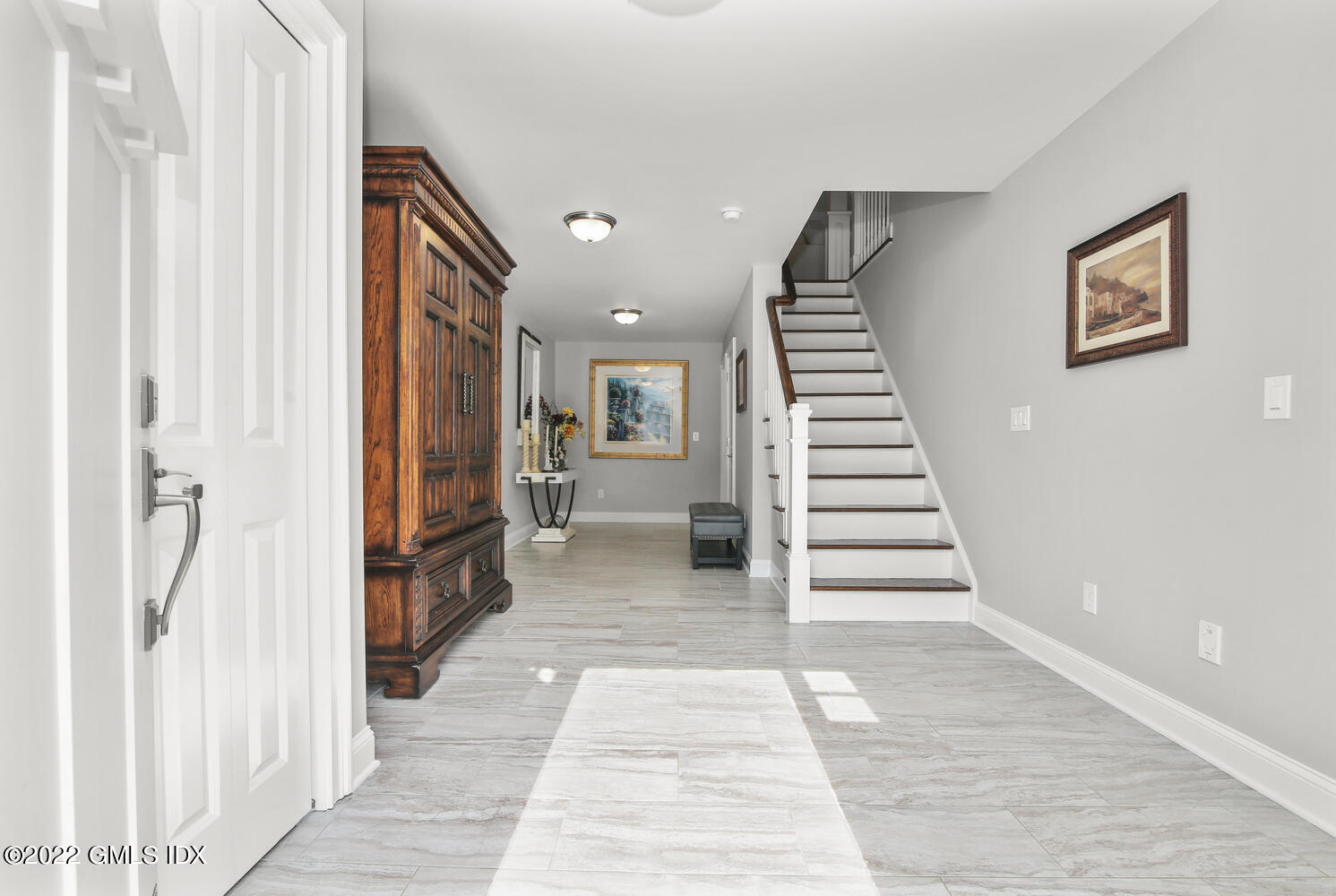 24 Harold Street, Unit C Cos Cob, CT 06807 - Photo 4 of 32 a view of a hallway with a white walls and stairs