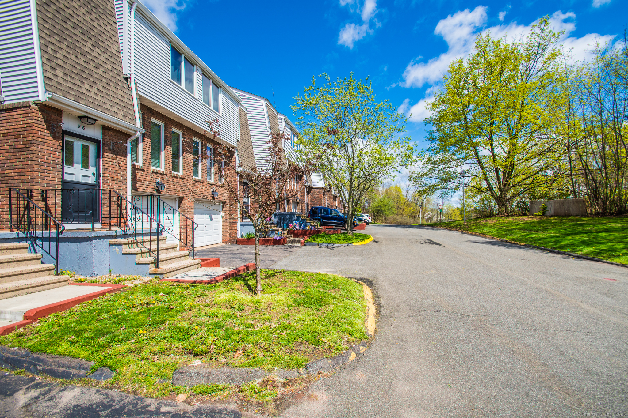184 Gravel Street, Unit 26 Meriden, CT 06450 - Photo 25 of 27 a front view of a building with garden