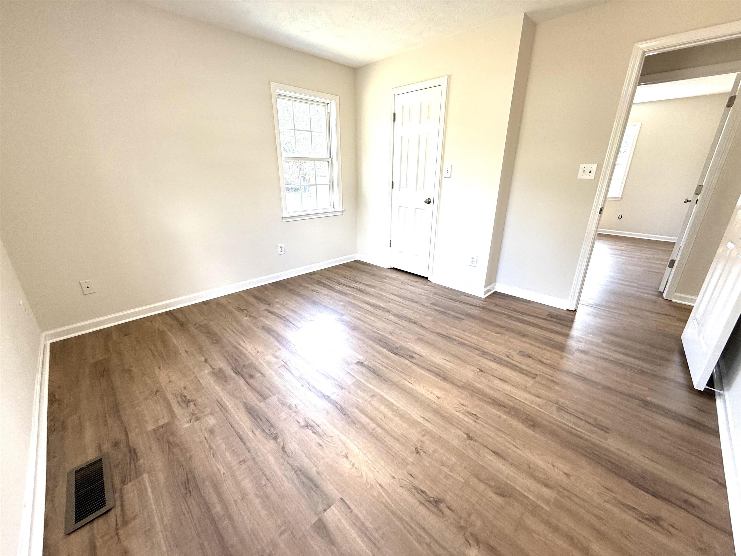 1250 Clifton Road Savannah, TN 38372 - Photo 11 of 33 Unfurnished bedroom featuring wood finished floors and baseboards