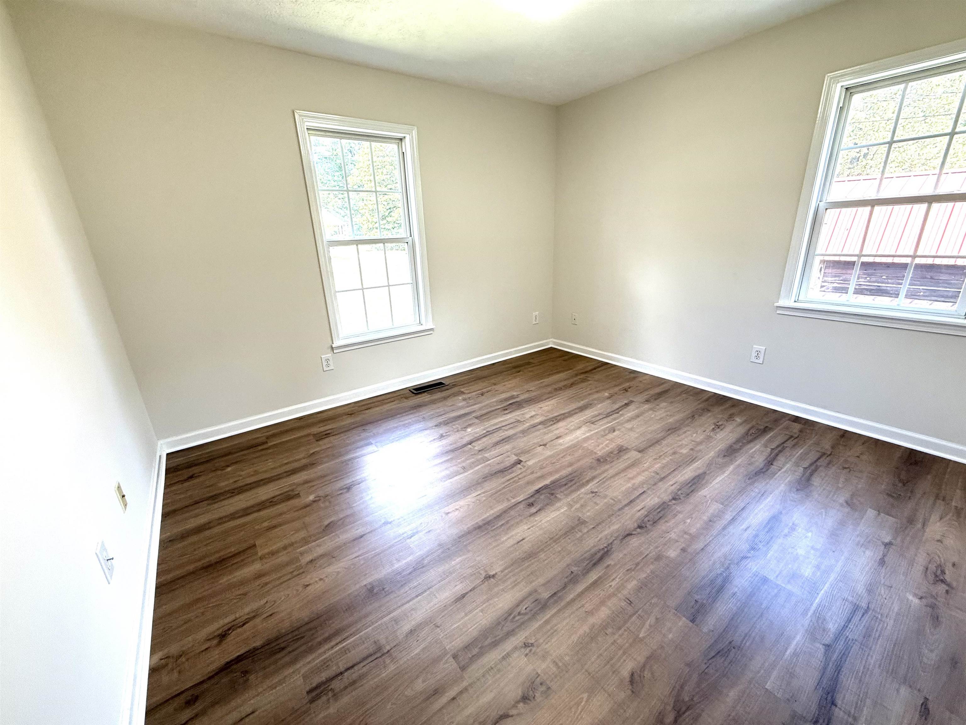1250 Clifton Road Savannah, TN 38372 - Photo 13 of 33 Unfurnished room featuring dark wood finished floors and baseboards
