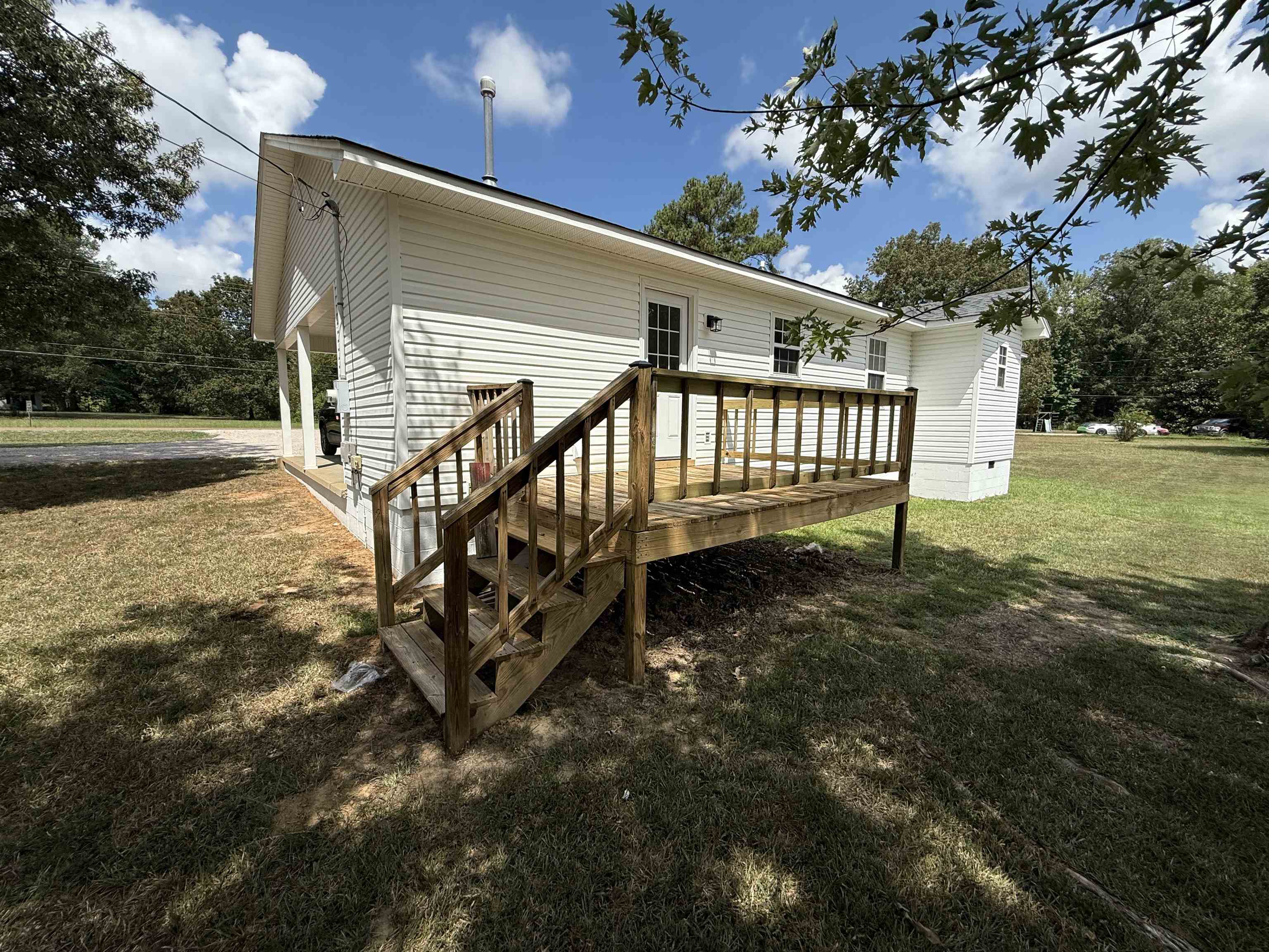 1250 Clifton Road Savannah, TN 38372 - Photo 25 of 33 Back of house with a yard and a wooden deck