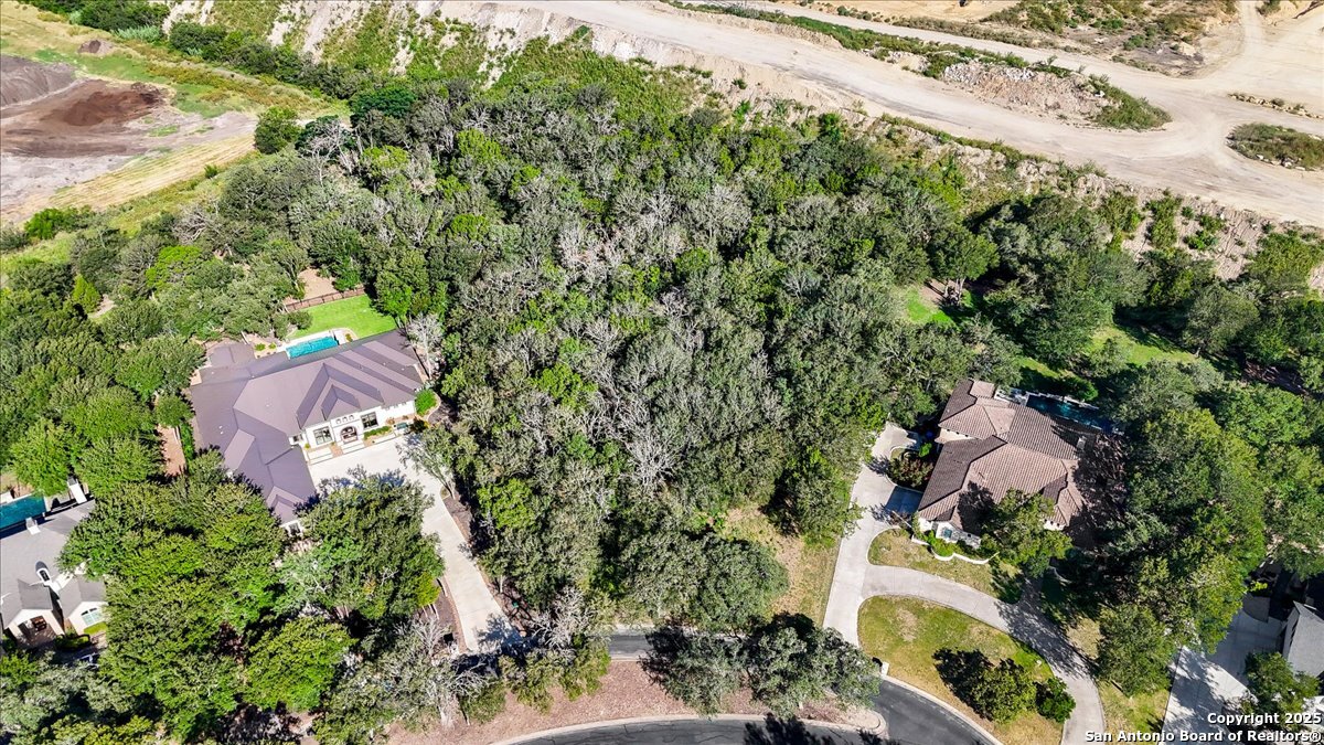 8403 Wild Wind Park Garden Ridge, TX 78266 - Photo 16 of 16 an aerial view of house with yard and mountain view in back