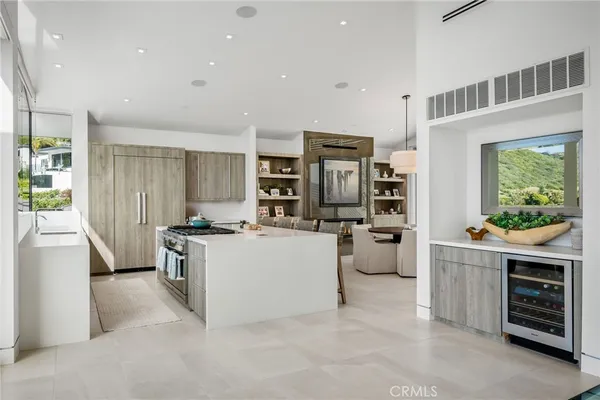 a kitchen with a refrigerator and a stove