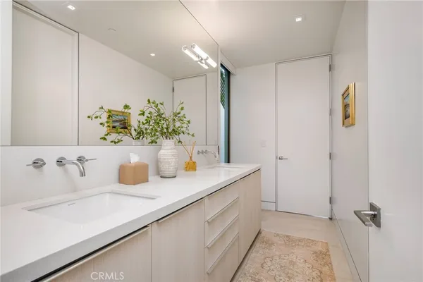 a bathroom with a sink a vanity and a mirror