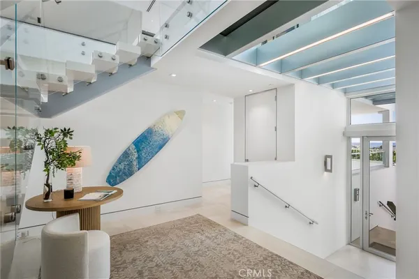 a view of a living room and entryway