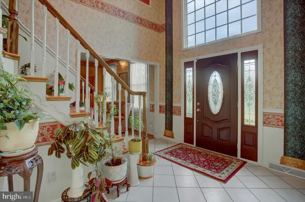 a front view of a house with a door and a glass door