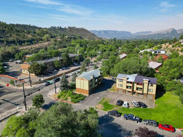 an aerial view of a house with a garden