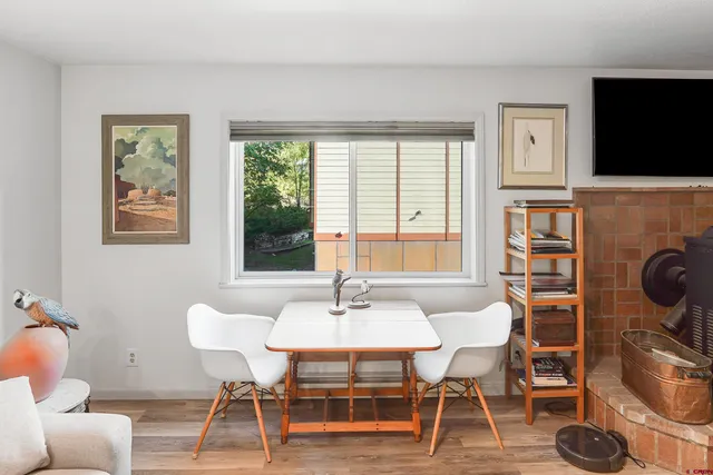 a dining room with furniture and window