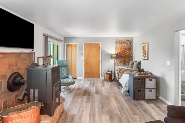 a view of a livingroom with furniture and a flat screen tv