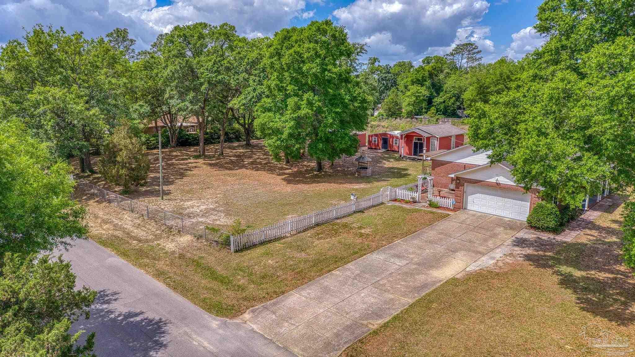 4959 Skipper Lane Pace, FL 32571 - Photo 2 of 51 a view of backyard with green space