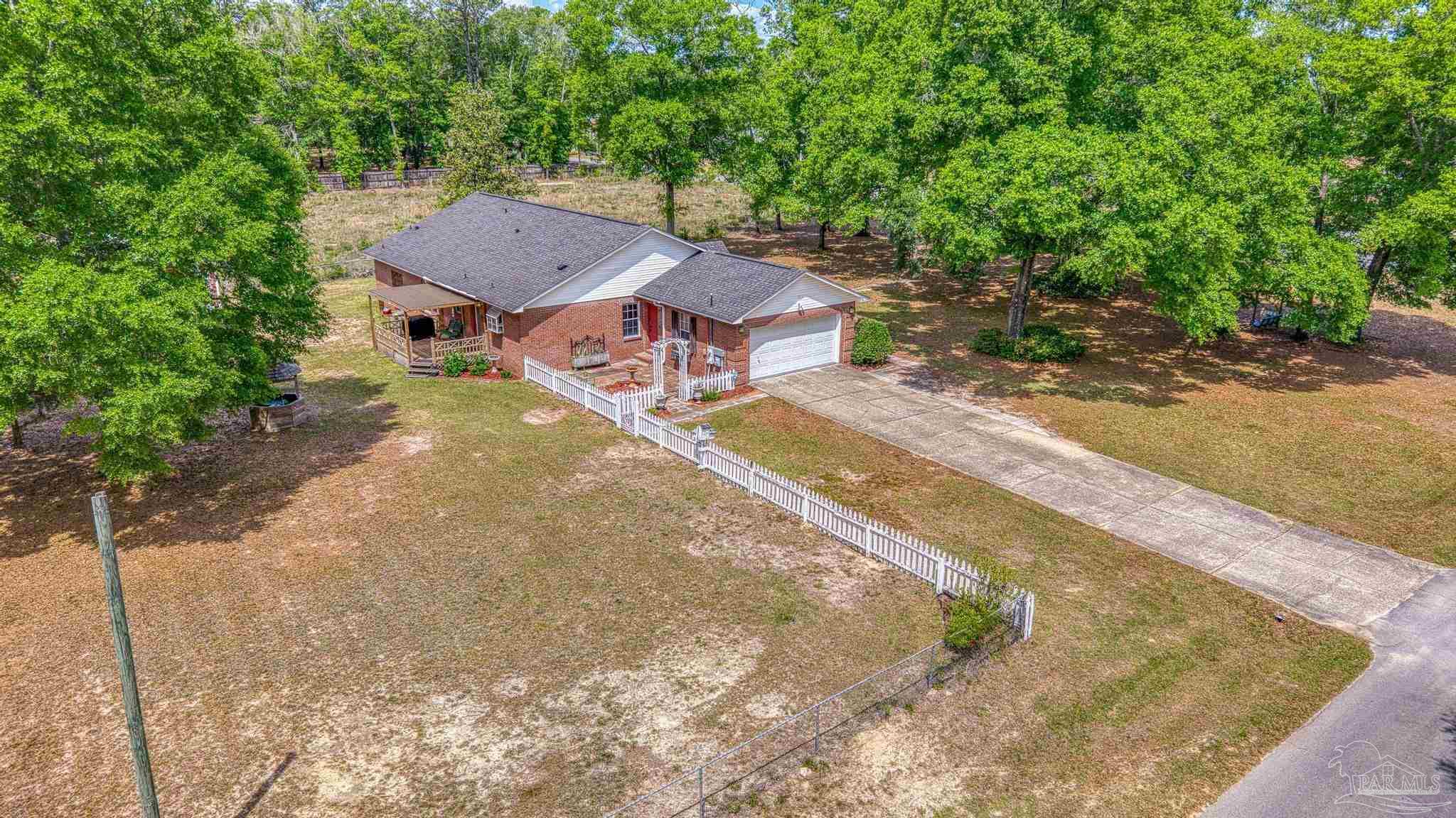 4959 Skipper Lane Pace, FL 32571 - Photo 49 of 51 a view of a house with a yard
