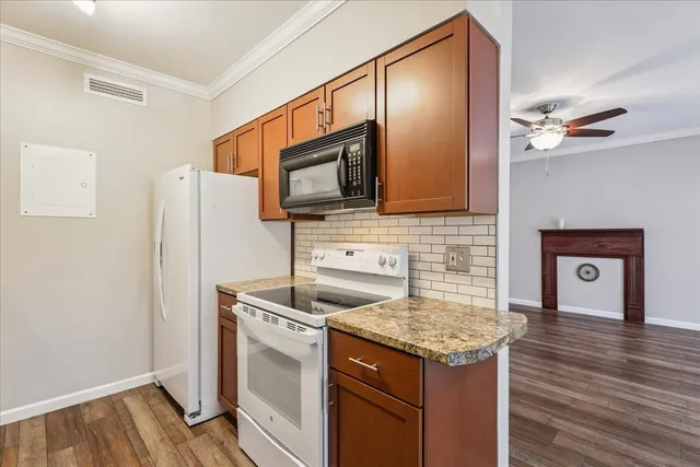 a kitchen with a stove microwave and refrigerator