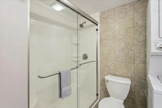 a bathroom with a toilet and shower