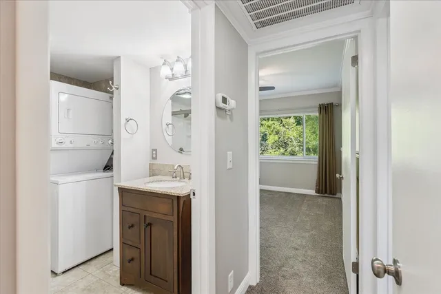 a en suite bathroom with a sink a mirror and a shower