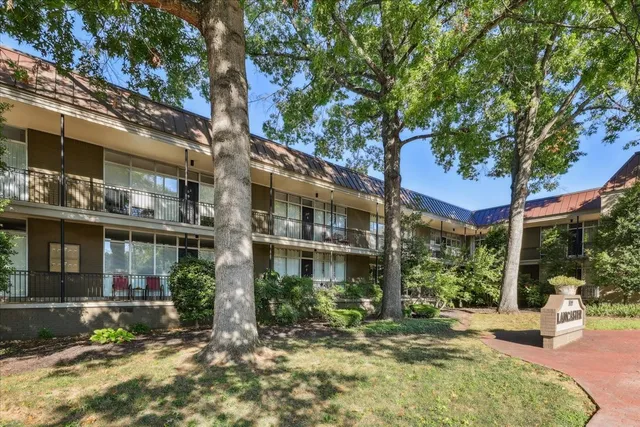 a view of a building with a yard