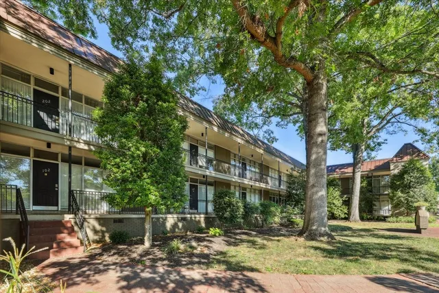 a front view of a building with garden