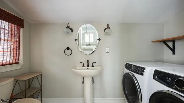 a view of livingroom with washer and dryer
