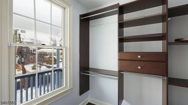 a view of walk in closet with window