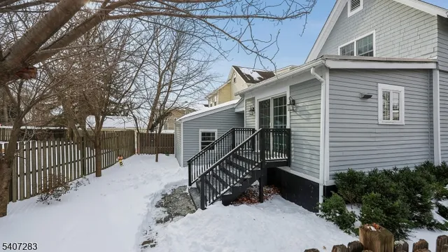 a front view of house with wooden stairs