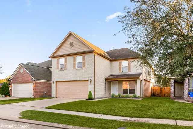 front view of a house next to a yard