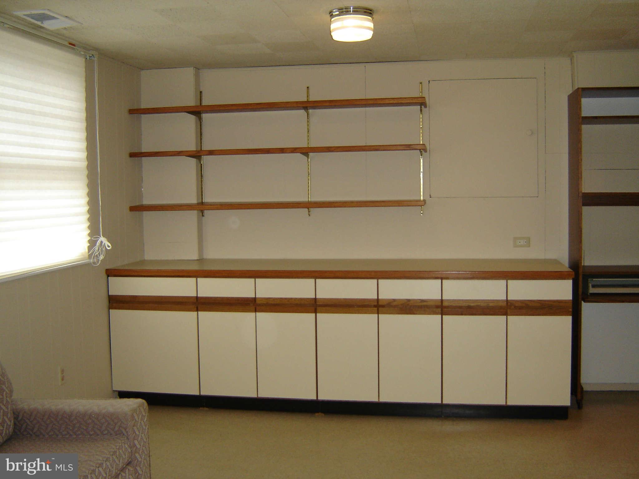8402 Charlton Road Randallstown, MD 21133 - Photo 12 of 30 Family Room with Storage Cabinets