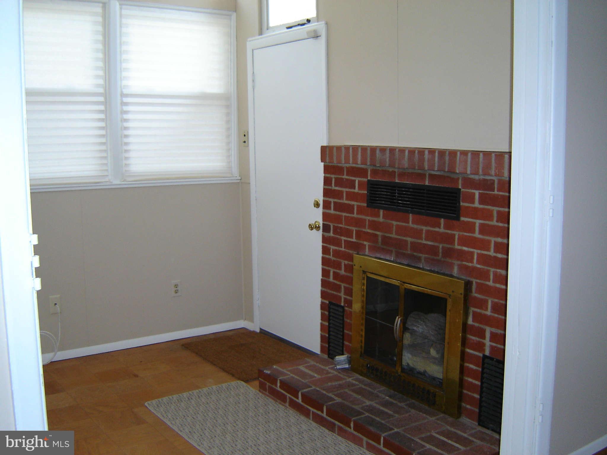 8402 Charlton Road Randallstown, MD 21133 - Photo 19 of 30 Den with Fireplace