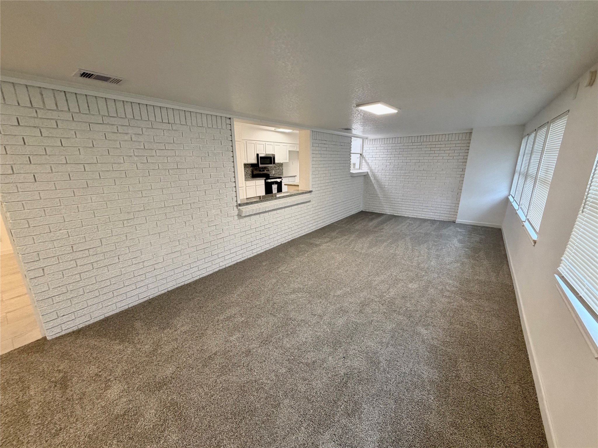 316 Angle Street Angleton, TX 77515 - Photo 12 of 30 a view of an empty room with a window