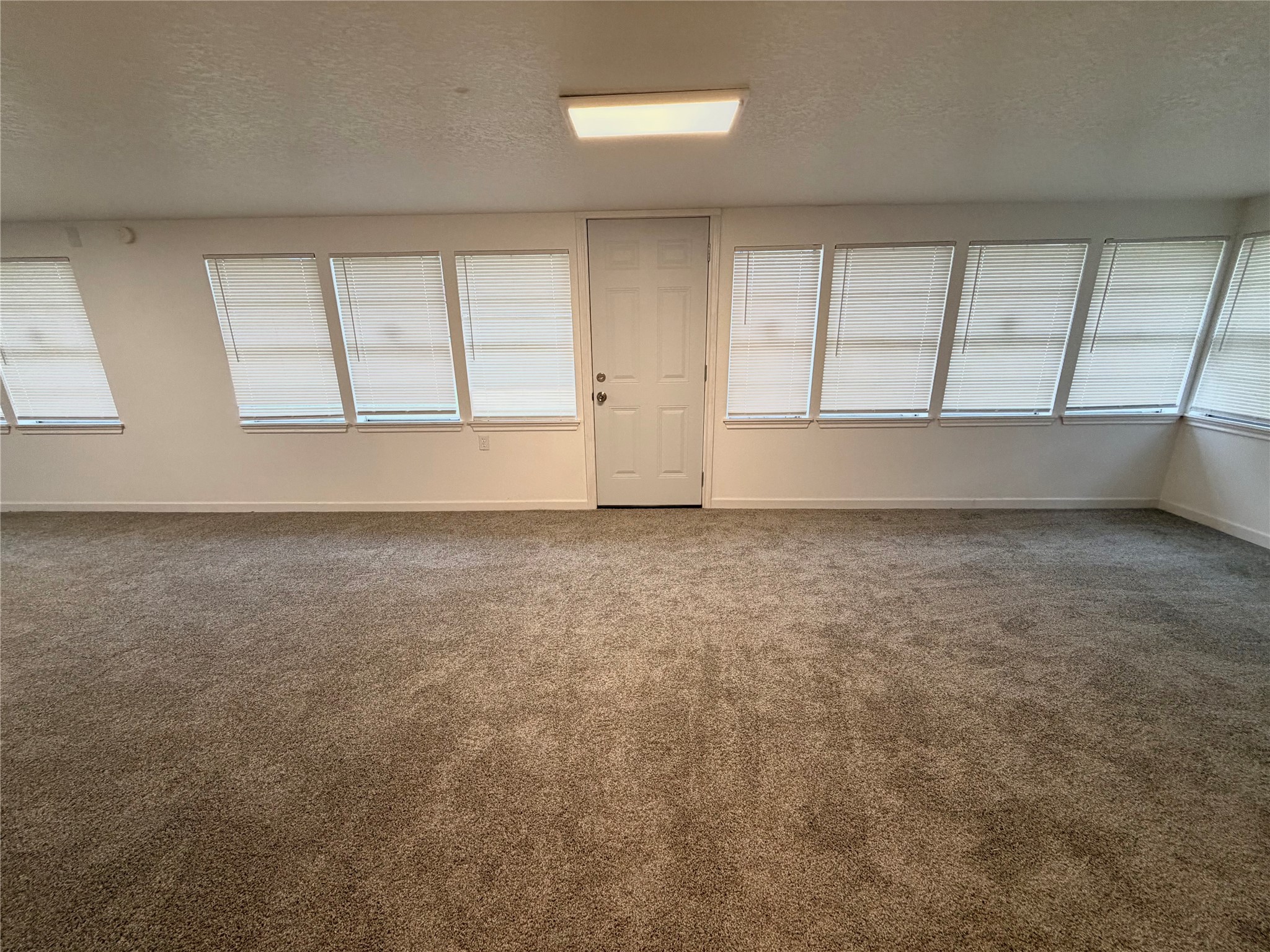 316 Angle Street Angleton, TX 77515 - Photo 14 of 30 an empty room with windows