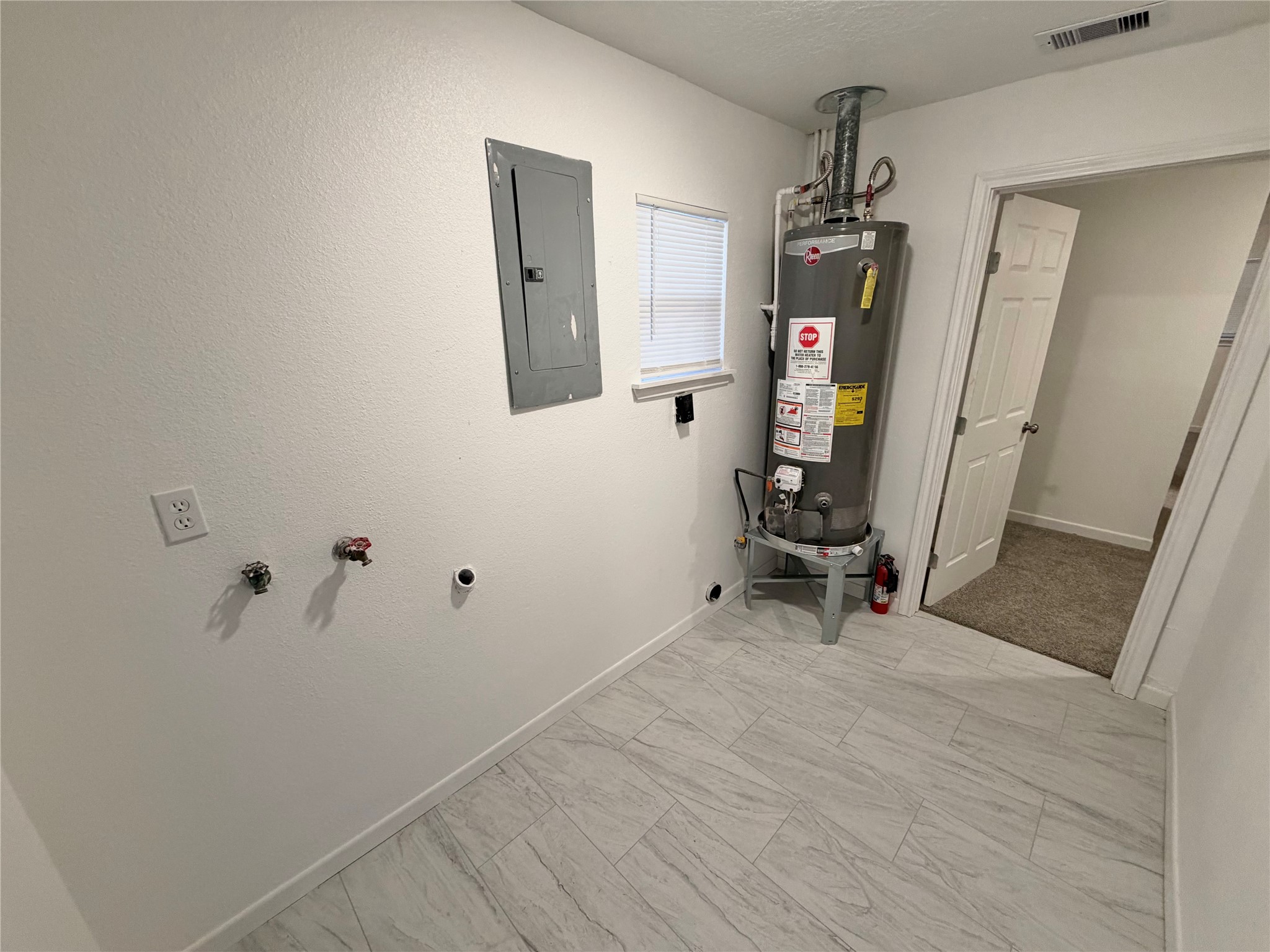 316 Angle Street Angleton, TX 77515 - Photo 15 of 30 a view of a hallway with wooden floor and a cabinet