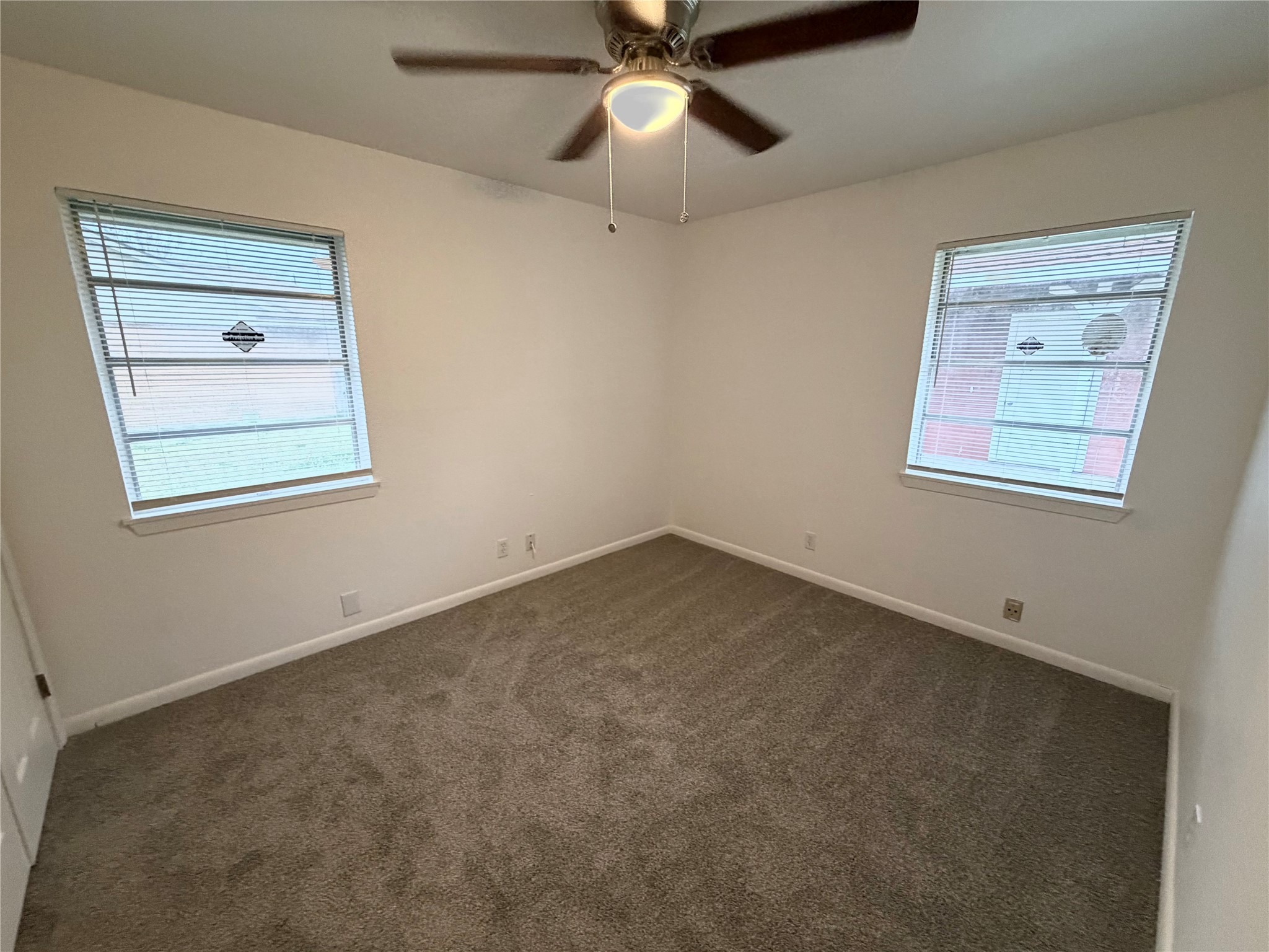316 Angle Street Angleton, TX 77515 - Photo 25 of 30 a view of an empty room with a window
