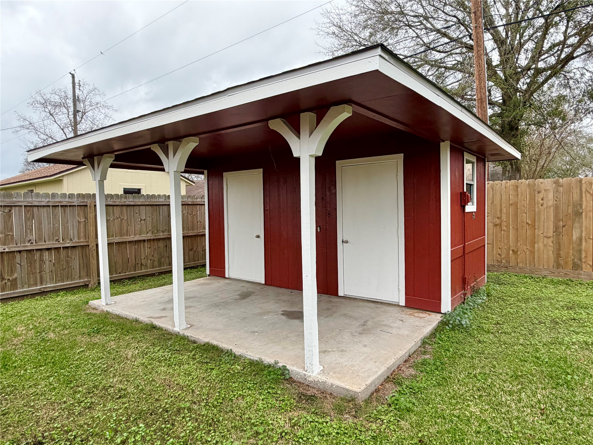 316 Angle Street Angleton, TX 77515 - Photo 29 of 30 a view of a house with a small yard and wooden fence