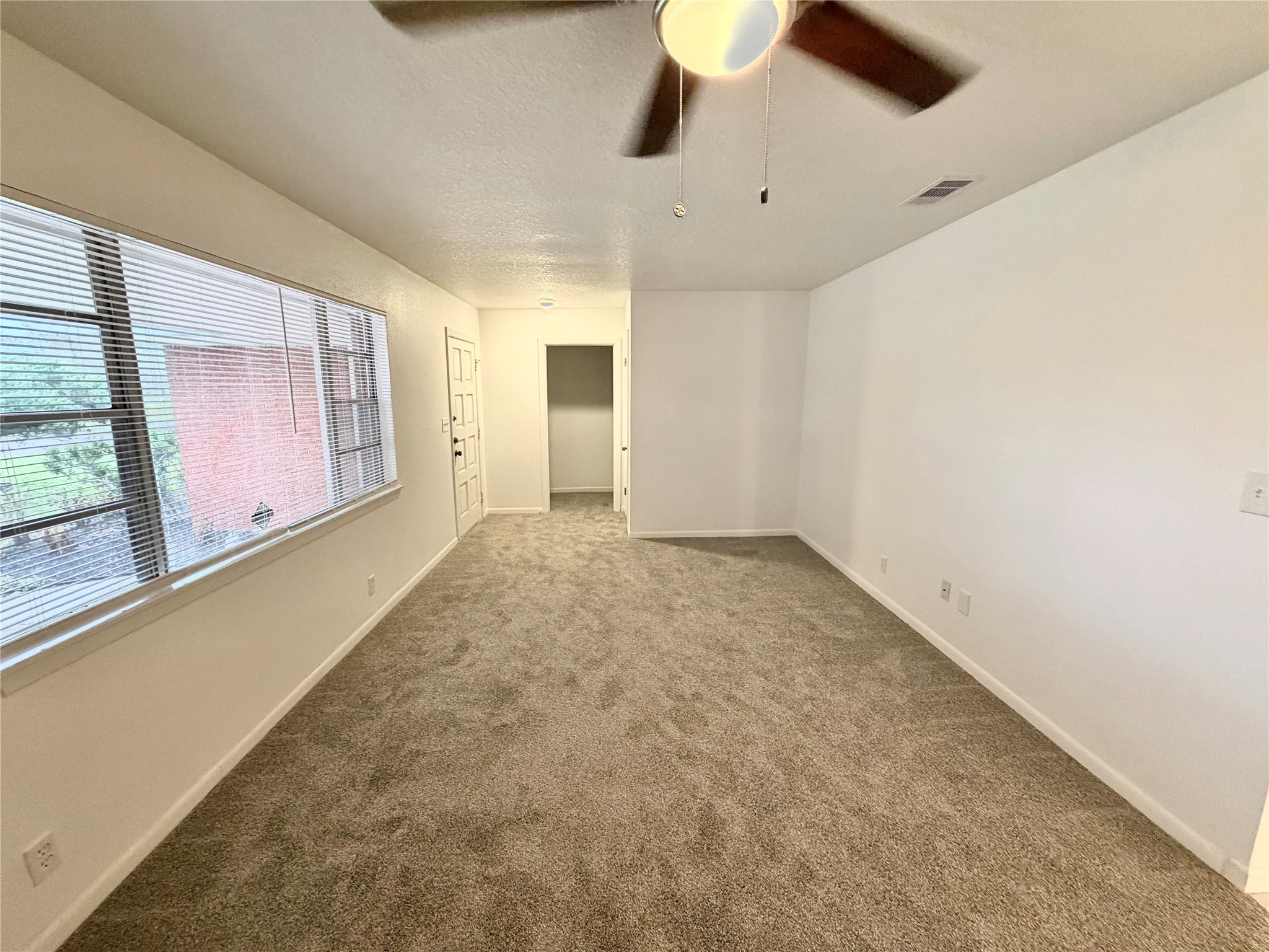 316 Angle Street Angleton, TX 77515 - Photo 4 of 30 a view of an empty room with a window