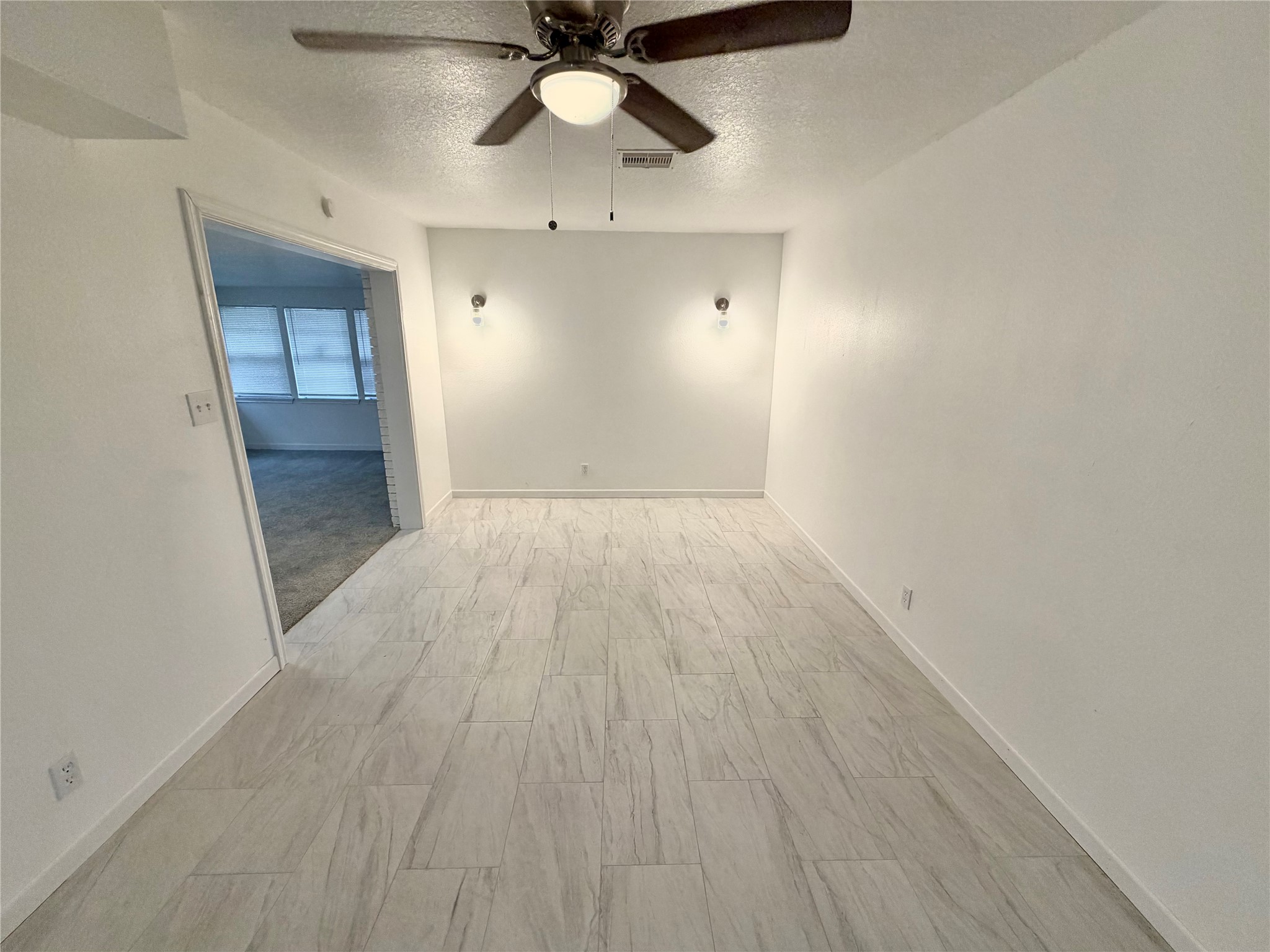 316 Angle Street Angleton, TX 77515 - Photo 6 of 30 wooden floor in an empty room with a window