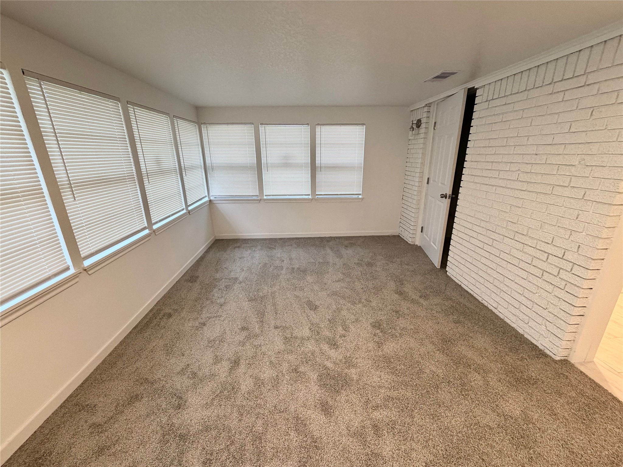 316 Angle Street Angleton, TX 77515 - Photo 9 of 30 a view of an empty room and window
